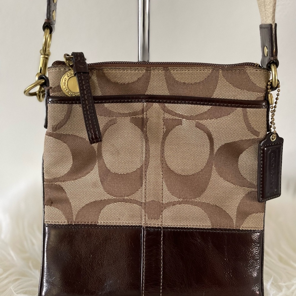 Authentic Coach logo crossbody purse. 8”W x 9”L. Canvas and leather material.
